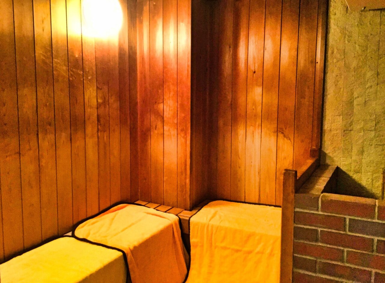 Wood-lined sauna room at a Japanese bathing facility