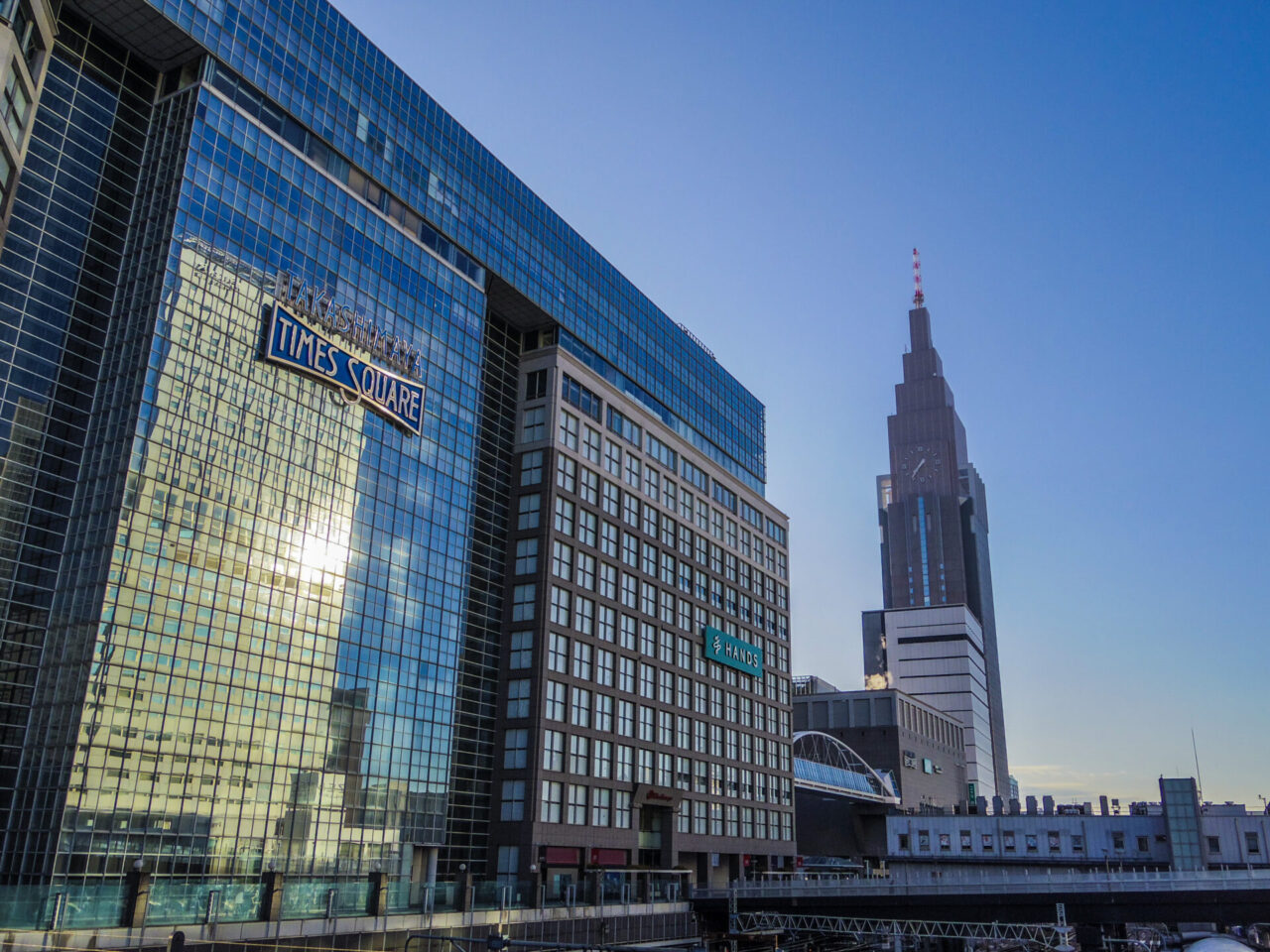 Shinjuku Takashimaya Times Square with the NTT Docomo Yoyogi Building behind it