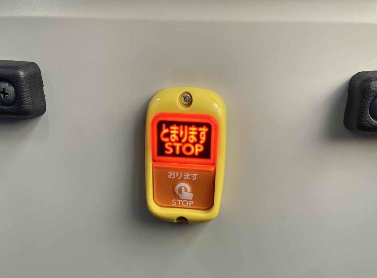 Illuminated stop request button inside a Japanese local bus