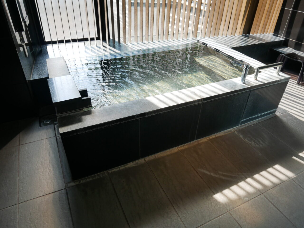 Private indoor bath at a Japanese hot spring facility
