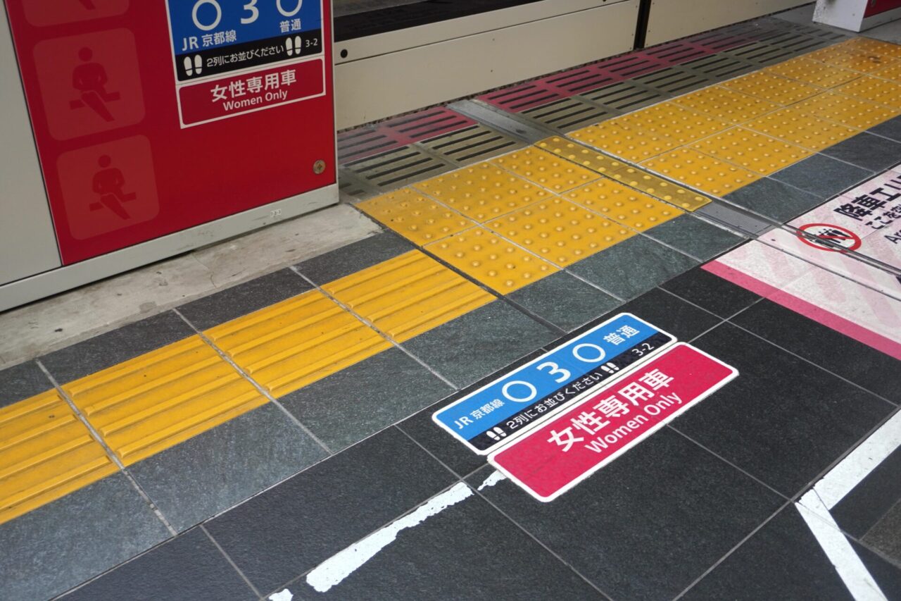 Women-only car boarding position marked on a railway platform in Japan